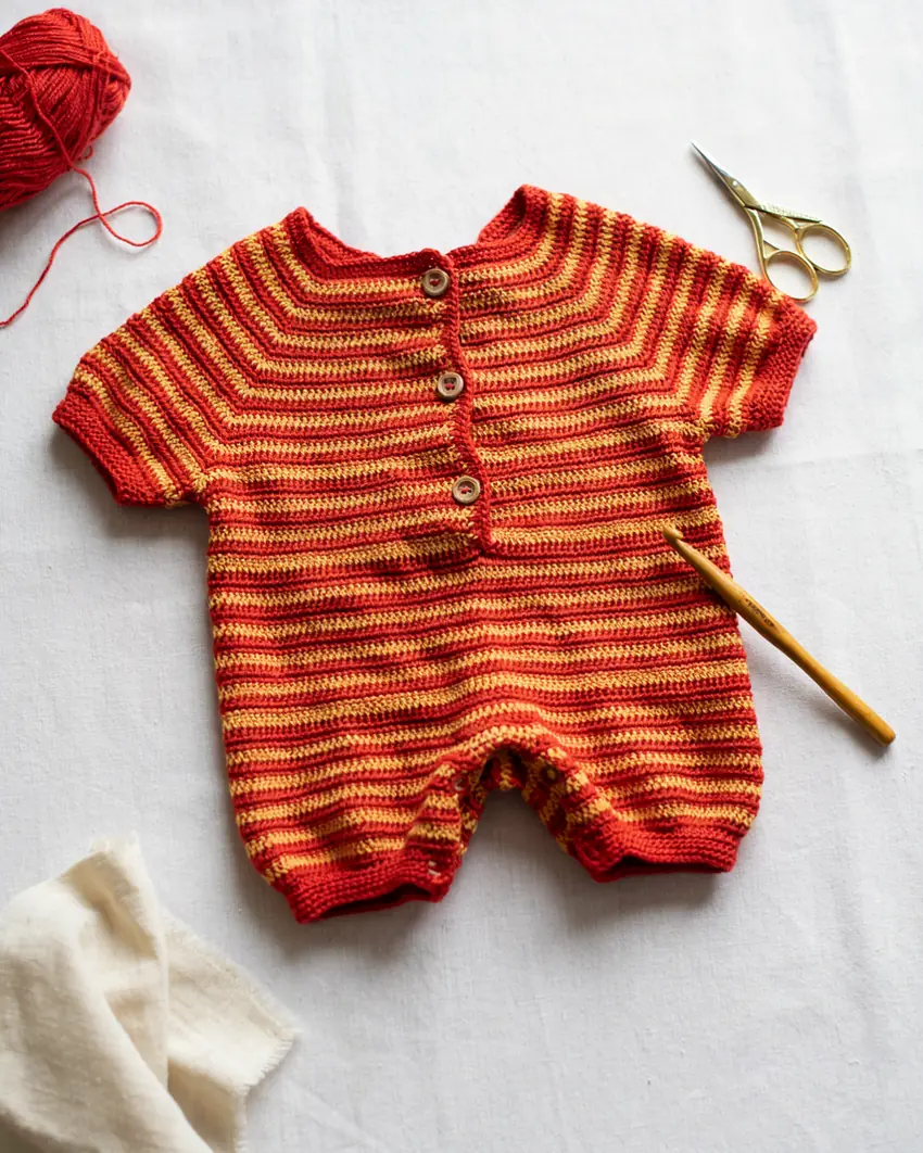 Bright handmade crochet baby romper in vivid red and yellow stripes, MapleHookCrochet colorful baby crochet pattern